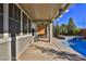 Inviting covered patio area featuring a grill and view of the pool and spa at 2832 Aragon Terrace Way, Henderson, NV 89044