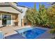 Relaxing spa surrounded by mature landscaping with blue water reflecting the sky at 2832 Aragon Terrace Way, Henderson, NV 89044