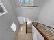 Bright foyer featuring a staircase with wooden rails and modern tiled flooring at 2832 Aragon Terrace Way, Henderson, NV 89044