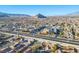 Panoramic aerial view of a residential neighborhood surrounded by mountains and lush greenery at 3112 Hayden Ct, Las Vegas, NV 89134