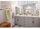 Bathroom featuring a double vanity with a gray cabinet, and modern fixtures at 3112 Hayden Ct, Las Vegas, NV 89134