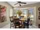 Bright dining area with large windows offering views of the well-maintained backyard at 3112 Hayden Ct, Las Vegas, NV 89134