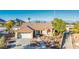 Beautiful single-story home showcasing desert landscaping, a two-car garage, and a red-tiled roof at 3112 Hayden Ct, Las Vegas, NV 89134