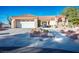 Inviting single-story home with a tile roof, desert landscaping, and an attached two-car garage at 3112 Hayden Ct, Las Vegas, NV 89134