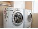 Bright laundry room featuring a modern washer and dryer unit at 3112 Hayden Ct, Las Vegas, NV 89134