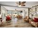 Bright living room with wood floors, ceiling fans, and access to the patio through sliding glass doors at 3112 Hayden Ct, Las Vegas, NV 89134