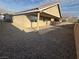 View of the backyard with rock landscape, covered patio, and surroundings at 3208 Paragon Pointe St, Las Vegas, NV 89129