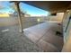 This backyard patio is spacious with rock landscaping, concrete flooring, and a covered patio at 3208 Paragon Pointe St, Las Vegas, NV 89129