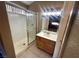 The bathroom includes a glass shower door, a vanity, and tiled walls at 3208 Paragon Pointe St, Las Vegas, NV 89129