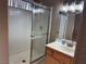 The bathroom has a shower and a sink with a single wood vanity at 3208 Paragon Pointe St, Las Vegas, NV 89129