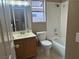 Bathroom with a tub-shower combo with tiled walls and a wood vanity with mirror at 3208 Paragon Pointe St, Las Vegas, NV 89129