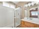 Well-lit bathroom featuring a glass shower and solid surface vanity at 3208 Paragon Pointe St, Las Vegas, NV 89129