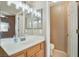 Bathroom featuring double mirrors, white vanity, and access to the toilet and shower area at 3208 Paragon Pointe St, Las Vegas, NV 89129