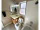 This bathroom features tile flooring, a shower-tub combo, a single sink vanity, and a window for natural light at 3208 Paragon Pointe St, Las Vegas, NV 89129