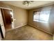 View of bedroom with carpet, baseboards, and a window with blinds and curtains at 3208 Paragon Pointe St, Las Vegas, NV 89129