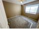 This bedroom features neutral walls, carpet flooring, a ceiling fan, and a window for natural light at 3208 Paragon Pointe St, Las Vegas, NV 89129