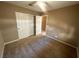 Bedroom with a ceiling fan and a closet with bi-fold doors, and a doorway at 3208 Paragon Pointe St, Las Vegas, NV 89129