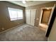 Bedroom with a window, double-door closet, carpet and neutral walls at 3208 Paragon Pointe St, Las Vegas, NV 89129