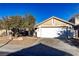 Charming single-story home features a two-car garage, desert landscaping, and a cozy, inviting entrance at 3208 Paragon Pointe St, Las Vegas, NV 89129