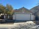 Inviting home with a two-car garage, tiled roof, and desert-friendly landscaping offering great curb appeal at 3208 Paragon Pointe St, Las Vegas, NV 89129