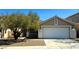 Lovely home with a two-car garage, tiled roof, and drought-tolerant landscaping, perfect for low maintenance living at 3208 Paragon Pointe St, Las Vegas, NV 89129