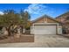 Charming home featuring desert landscaping, covered entry and a two-car garage at 3208 Paragon Pointe St, Las Vegas, NV 89129