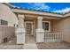 Covered front porch showcasing decorative columns and a glass front door at 3208 Paragon Pointe St, Las Vegas, NV 89129