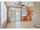 Bright eat-in kitchen featuring tile backsplash, oak cabinets, and modern appliances at 3208 Paragon Pointe St, Las Vegas, NV 89129