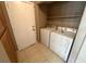 Laundry room with washer, dryer, and neutral-colored walls and floors at 3208 Paragon Pointe St, Las Vegas, NV 89129