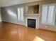 Spacious living room featuring a fireplace with mantle and hearth, and plantation shutters at 3208 Paragon Pointe St, Las Vegas, NV 89129