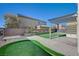 Backyard featuring a putting green, pergola, and desert landscaping at 3356 Dalmore St, Henderson, NV 89044