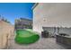 This home features a putting green, gravel, and AC units in the backyard at 3356 Dalmore St, Henderson, NV 89044