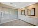 Bathroom showcasing double sinks, framed mirrors, tile floors, and large glass shower at 3356 Dalmore St, Henderson, NV 89044