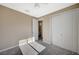 Neutral bedroom featuring plush gray carpeting, fan, and a closet with sliding doors at 3356 Dalmore St, Henderson, NV 89044