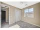 Cozy bedroom with neutral walls, plush carpet, a ceiling fan, and a closet with sleek sliding doors at 3356 Dalmore St, Henderson, NV 89044