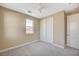 Bedroom with neutral walls, carpet, and a ceiling fan, offering simplicity and comfort at 3356 Dalmore St, Henderson, NV 89044