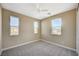 Bright bedroom features three windows, neutral carpet, and white trim at 3356 Dalmore St, Henderson, NV 89044