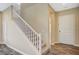 Hallway and stairs leading to the upper level of the house; stairs are carpeted; hardwood floors in the hall at 3356 Dalmore St, Henderson, NV 89044