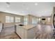 Bright kitchen with stainless steel appliances, island with sink, and a view to other living areas at 3356 Dalmore St, Henderson, NV 89044