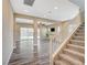 Bright living room with wood floors, recessed lighting, and open floorplan leading to the backyard at 3356 Dalmore St, Henderson, NV 89044