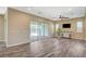 Comfortable living room with wood floor, sliding door to backyard, and ceiling fan at 3356 Dalmore St, Henderson, NV 89044