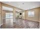 Open-concept living room with wood flooring and natural light at 3356 Dalmore St, Henderson, NV 89044