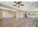 Spacious living room that connects the stairs and kitchen, with wood floors and plenty of space at 3356 Dalmore St, Henderson, NV 89044