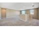 Spacious and carpeted loft area with natural light from the windows at 3356 Dalmore St, Henderson, NV 89044