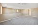 Open loft area with neutral color carpet and walls, ceiling fan, and recessed lighting at 3356 Dalmore St, Henderson, NV 89044