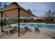 Relaxing community pool area featuring shaded seating and crystal-clear water at 3356 Dalmore St, Henderson, NV 89044