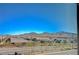 Expansive street view of homes with mountains in background on a clear sunny day at 3356 Dalmore St, Henderson, NV 89044