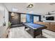 Entertaining game room featuring a billiards table, skylights, neon sign, and stylish wood grain vinyl floors at 3543 Algonquin Dr, Las Vegas, NV 89169