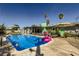 Backyard pool with a floating flamingo and lounge chairs, perfect for relaxation at 3543 Algonquin Dr, Las Vegas, NV 89169