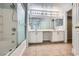 Bathroom featuring double sinks, vanity, shower and bathtub at 3558 Harbor Tides St, Las Vegas, NV 89147